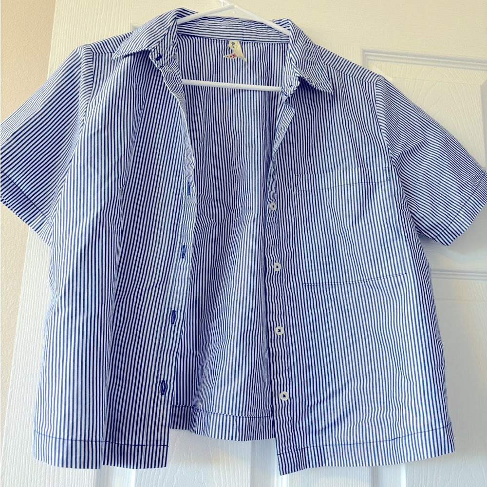 Girl Krazy blue stripe button top. Short sleeves and pocket on the left.